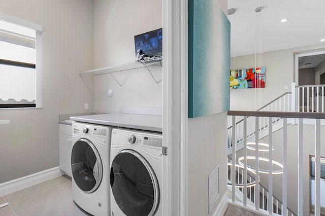 16202 Cabernet Dr, Delray Beach, FL 33446 - laundry area featuring washing machine and clothes dryer, baseboards, recessed lighting, laundry area, and light tile patterned floors