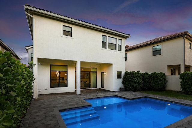 16202 Cabernet Dr, Delray Beach, FL 33446 - rear view of property featuring fence, a patio area, a fenced in pool, and stucco siding