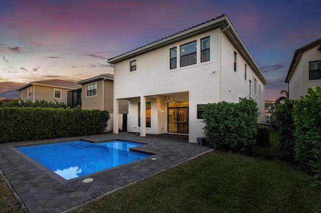 16202 Cabernet Dr, Delray Beach, FL 33446 - rear view of property with a fenced in pool, a fenced backyard, a patio area, a yard, and stucco siding