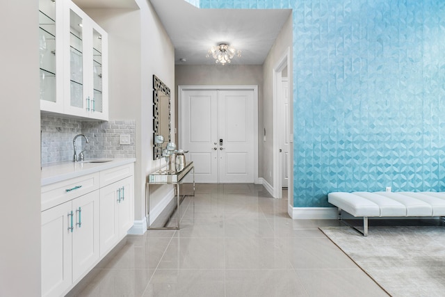 16202 Cabernet Dr, Delray Beach, FL 33446 - foyer with baseboards and a chandelier