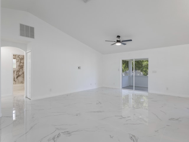 1201 SW Paar Dr, Port Saint Lucie, FL 34953 - empty room with lofted ceiling, marble finish floor, visible vents, arched walkways, and a ceiling fan