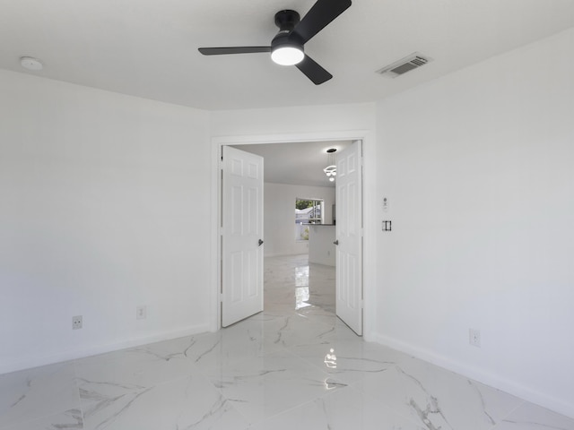 1201 SW Paar Dr, Port Saint Lucie, FL 34953 - spare room featuring a ceiling fan, marble finish floor, baseboards, and visible vents