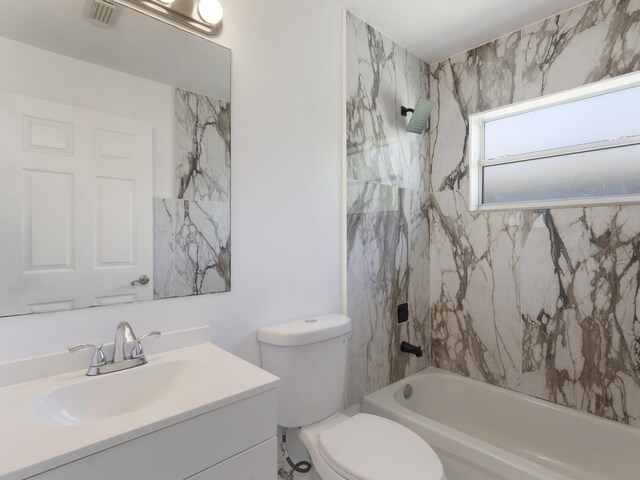 1201 SW Paar Dr, Port Saint Lucie, FL 34953 - bathroom featuring toilet, visible vents, vanity, and shower / washtub combination