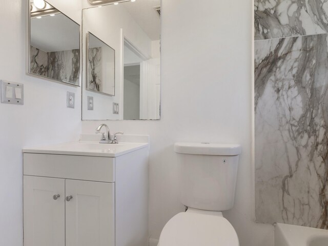 1201 SW Paar Dr, Port Saint Lucie, FL 34953 - full bath featuring toilet, vanity, a shower, and a bathing tub
