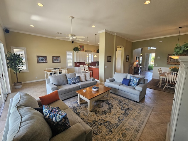411 NW Stratford Ln, Port Saint Lucie, FL 34983 - living area with arched walkways, plenty of natural light, ornamental molding, light tile patterned floors, and recessed lighting