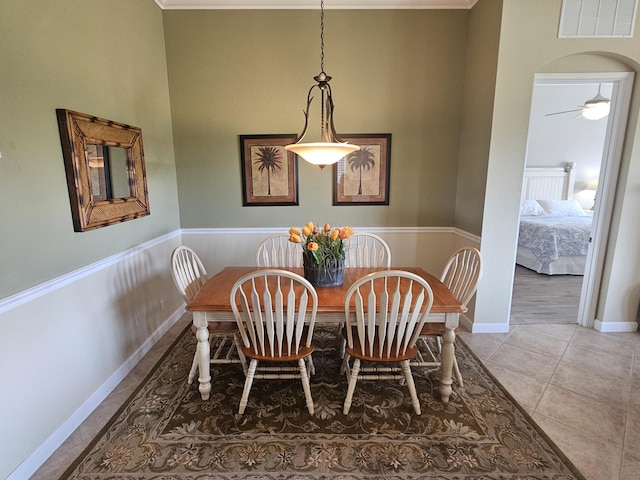 411 NW Stratford Ln, Port Saint Lucie, FL 34983 - tiled dining space with baseboards and ceiling fan