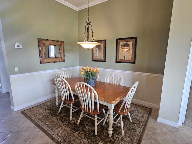 411 NW Stratford Ln, Port Saint Lucie, FL 34983 - dining room featuring ornamental molding, tile patterned floors, and baseboards