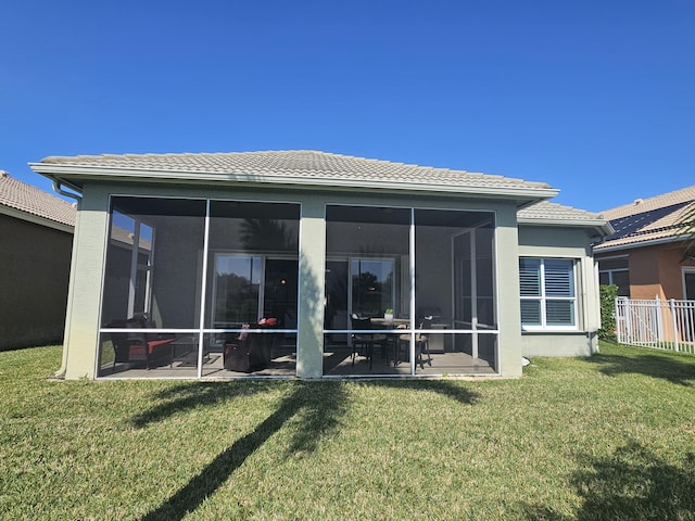 411 NW Stratford Ln, Port Saint Lucie, FL 34983 - rear view of house with a tile roof, a sunroom, and stucco siding
