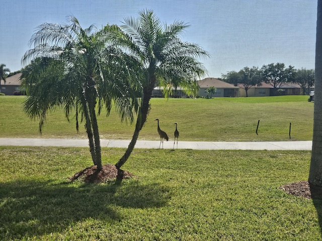 411 NW Stratford Ln, Port Saint Lucie, FL 34983 - view of community with a yard
