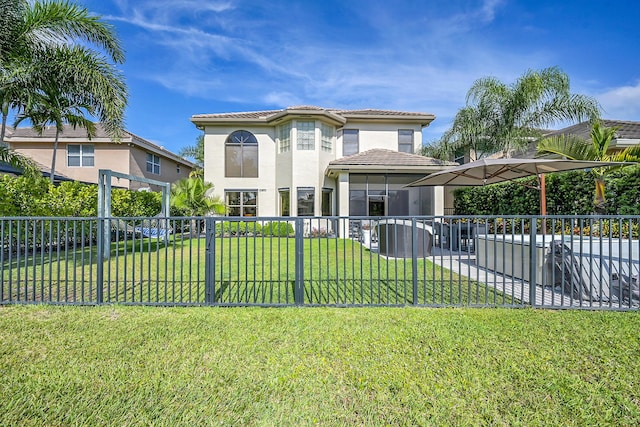 view of front of property with fence, a tiled roof, stucco siding, and a front lawn