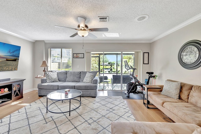 2190 Discovery Cir W, Deerfield Beach, FL 33442 - living room featuring plenty of natural light, visible vents, a ceiling fan, and wood finished floors