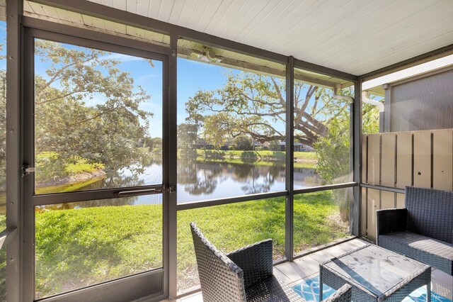 2190 Discovery Cir W, Deerfield Beach, FL 33442 - unfurnished sunroom with a water view and a wealth of natural light