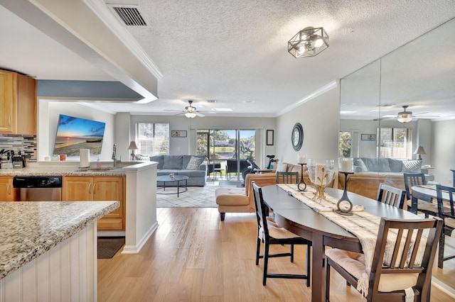 2190 Discovery Cir W, Deerfield Beach, FL 33442 - dining space featuring light wood-style flooring, visible vents, ceiling fan, and a textured ceiling