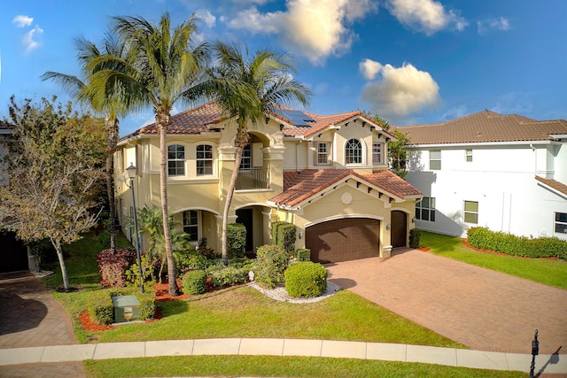 8207 Venosa Haven Ter, Boynton Beach, FL 33473 - mediterranean / spanish-style home featuring roof mounted solar panels, a tiled roof, stucco siding, and decorative driveway