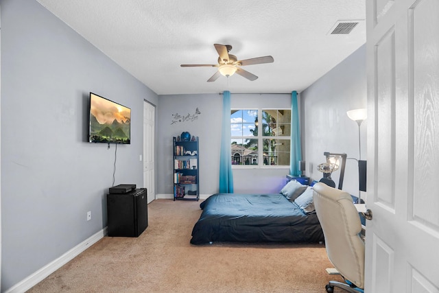 8207 Venosa Haven Ter, Boynton Beach, FL 33473 - carpeted bedroom featuring baseboards, visible vents, a textured ceiling, and ceiling fan