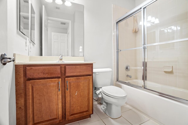 8207 Venosa Haven Ter, Boynton Beach, FL 33473 - bathroom with combined bath / shower with glass door, vanity, toilet, tile patterned flooring, and visible vents