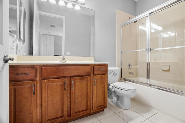 8207 Venosa Haven Ter, Boynton Beach, FL 33473 - bathroom with combined bath / shower with glass door, vanity, tile patterned flooring, and toilet