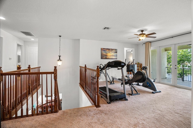 8207 Venosa Haven Ter, Boynton Beach, FL 33473 - exercise area featuring visible vents, carpet flooring, a textured ceiling, and recessed lighting