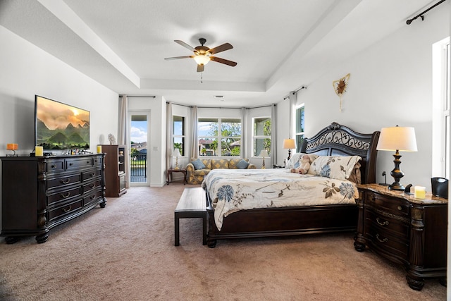 8207 Venosa Haven Ter, Boynton Beach, FL 33473 - bedroom with a tray ceiling, light carpet, a ceiling fan, and access to outside