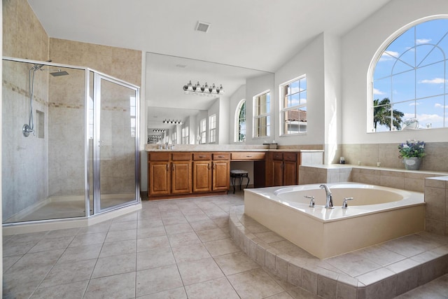 8207 Venosa Haven Ter, Boynton Beach, FL 33473 - bathroom with a bath, a shower stall, visible vents, and vanity