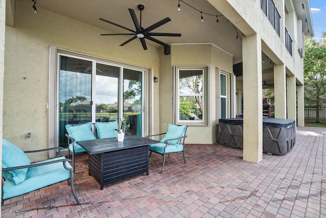 8207 Venosa Haven Ter, Boynton Beach, FL 33473 - view of patio / terrace with an outdoor hangout area, a hot tub, ceiling fan, and fence