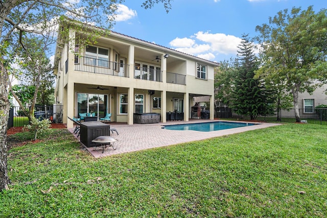 8207 Venosa Haven Ter, Boynton Beach, FL 33473 - rear view of house with a balcony, a lawn, outdoor lounge area, a fenced backyard, and ceiling fan