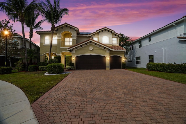 8207 Venosa Haven Ter, Boynton Beach, FL 33473 - mediterranean / spanish-style home with stucco siding, a tile roof, decorative driveway, and a front lawn