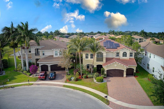 8207 Venosa Haven Ter, Boynton Beach, FL 33473 - mediterranean / spanish-style home with a garage, a residential view, a tiled roof, and decorative driveway