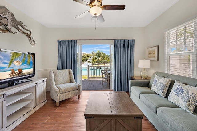 living area featuring wood finished floors and a ceiling fan