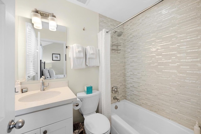 bathroom with shower / tub combo, toilet, and vanity
