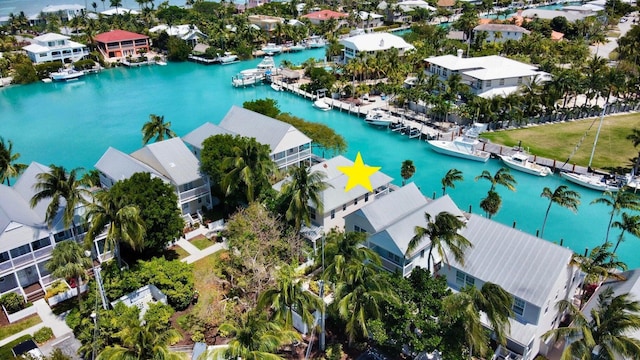 birds eye view of property with a residential view and a water view