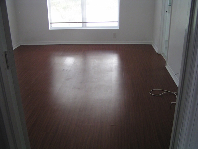 312 River Bluff Ln, Royal Palm Beach, FL 33411 - unfurnished room with healthy amount of natural light and dark wood-style flooring