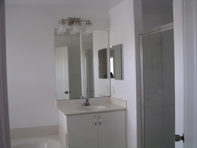 312 River Bluff Ln, Royal Palm Beach, FL 33411 - full bath featuring vanity, a shower stall, and a bathtub
