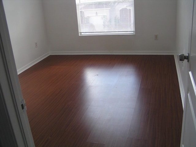 312 River Bluff Ln, Royal Palm Beach, FL 33411 - empty room featuring dark wood-style floors and baseboards