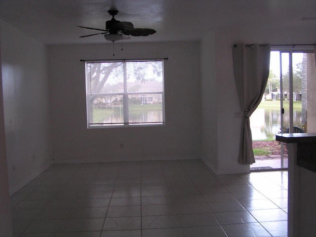 312 River Bluff Ln, Royal Palm Beach, FL 33411 - unfurnished room with plenty of natural light, light tile patterned floors, and ceiling fan