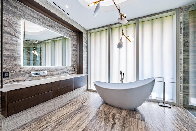 bathroom featuring a freestanding bath and walk in shower