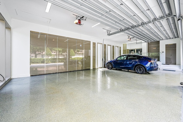 garage featuring a garage door opener