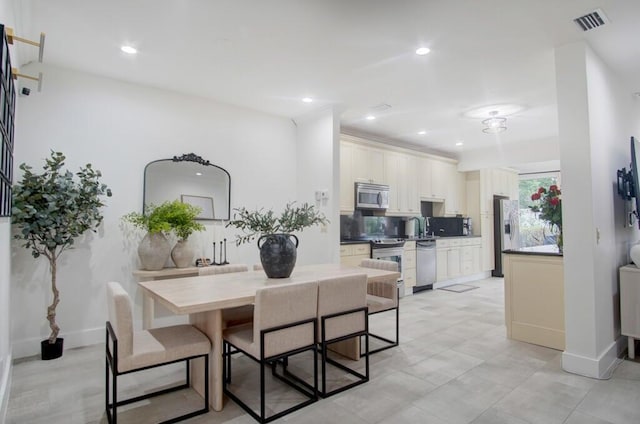 dining space with visible vents, baseboards, and recessed lighting