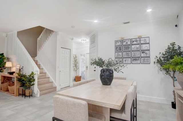 dining space featuring ornamental molding, baseboards, recessed lighting, and stairs