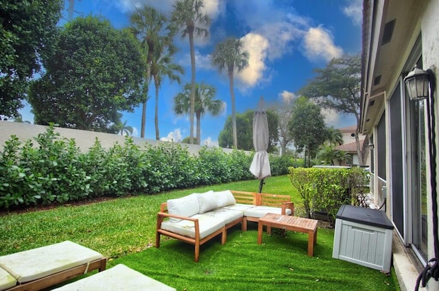 view of yard with fence and an outdoor hangout area