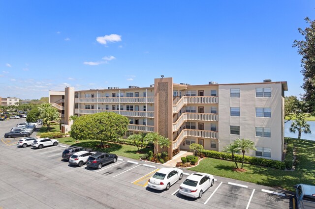 view of property with uncovered parking