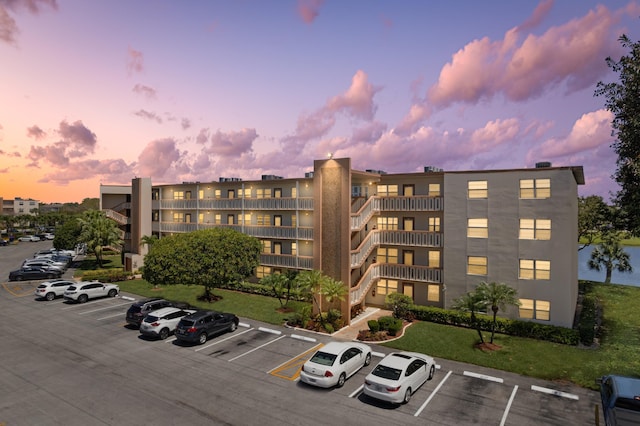 view of property with uncovered parking