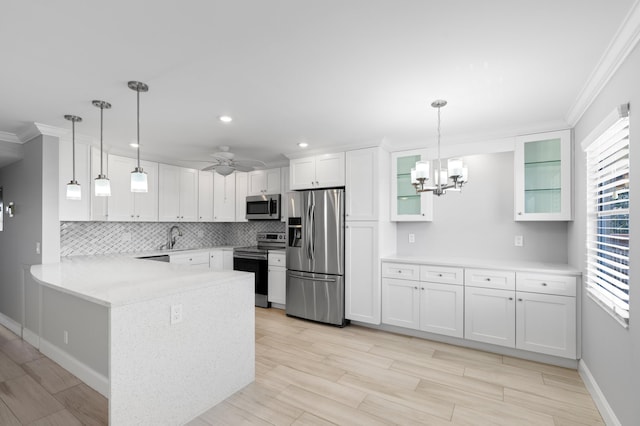 kitchen featuring tasteful backsplash, a peninsula, ornamental molding, and appliances with stainless steel finishes