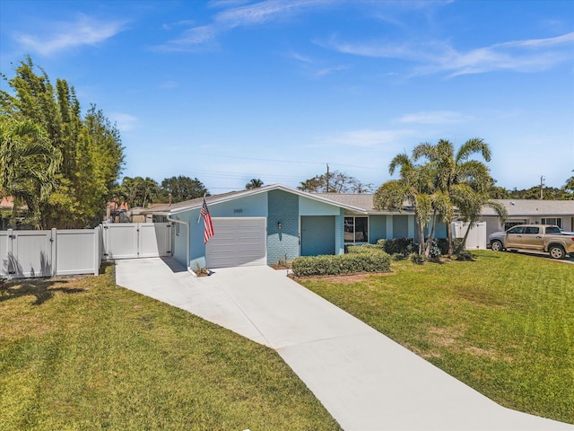 view of front facade featuring a gate, fence, a front lawn, concrete driveway, and an attached garage