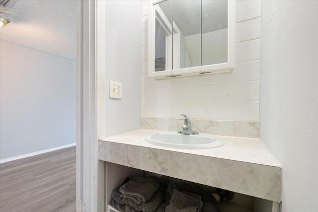 bathroom featuring vanity and wood finished floors