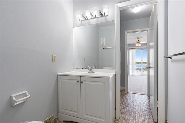bathroom featuring vanity, a ceiling fan, and tile patterned floors