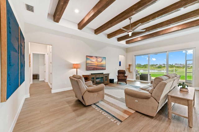 9891 SW Legacy Dr, Stuart, FL 34997 - living room with beamed ceiling, ceiling fan, light wood-style flooring, and recessed lighting