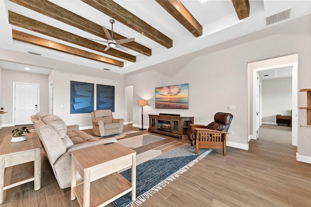 9891 SW Legacy Dr, Stuart, FL 34997 - living area with ceiling fan, beamed ceiling, and wood finished floors