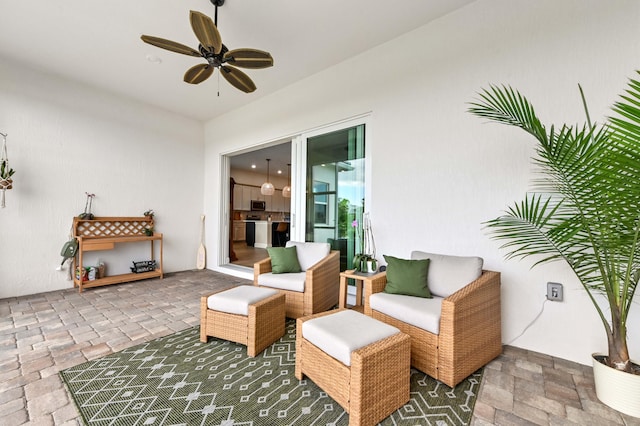 9891 SW Legacy Dr, Stuart, FL 34997 - view of patio featuring a ceiling fan and an outdoor living space