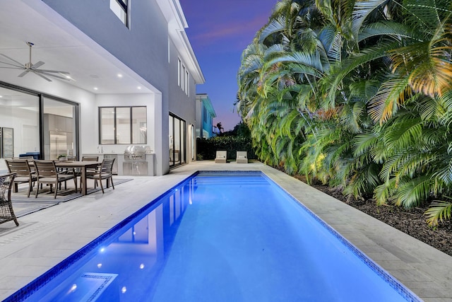 1133 NE 3rd Ave, Boca Raton, FL 33432 - view of swimming pool with a patio, a fenced in pool, exterior kitchen, area for grilling, and a ceiling fan